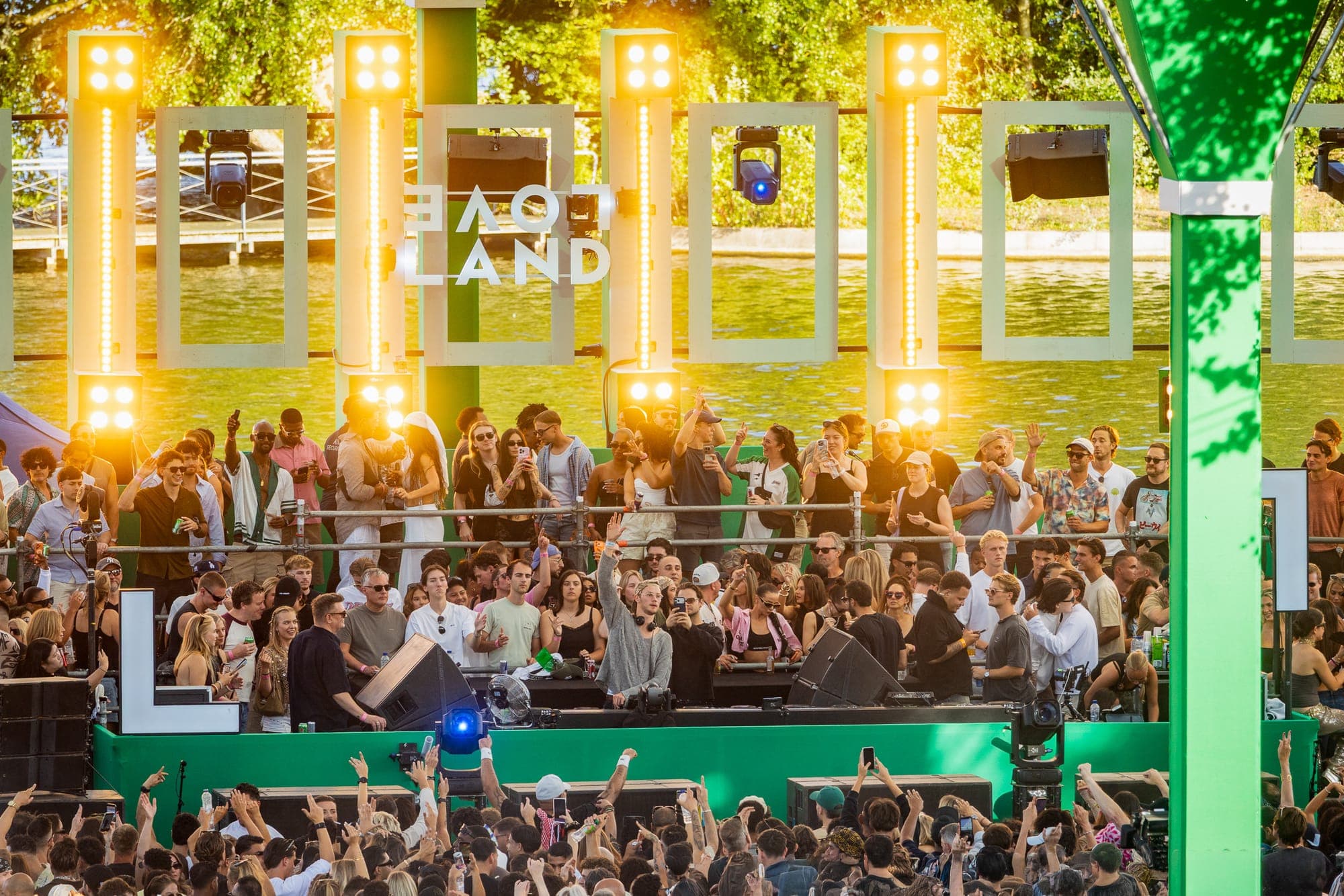 Crowd at the LOVELAND waterfront stage in Sloterpark Amsterdam during golden hour
